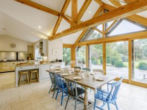a kitchen and dining room with a table and chairs at 5 Bed in Sherborne 79062 in Wincanton