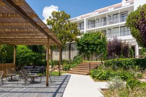 Vonkajšia záhrada v ubytovaní Hotel Alga