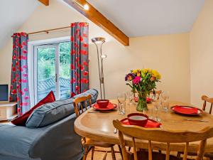 a living room with a table and a couch at 2 bed in Llangenny BN316 in Llangenny