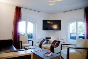 a living room with chairs and a table at TASTY LUXURY 3 BEDROOM FULL VIEW SEINE-NOTRE DAME in Paris