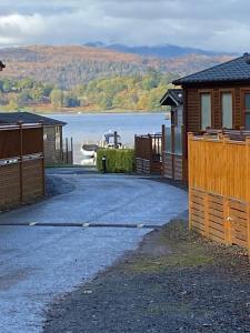 a house with a view of a lake and a building at V+B Hygge in Windermere
