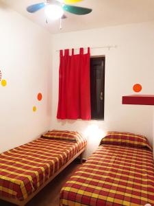 เตียงในห้องที่ Trilocale 30 Residence La Giungla
