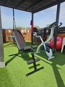 a gym with a treadmill and a exercise bike at La Maxada Luz Maria in Cotillo