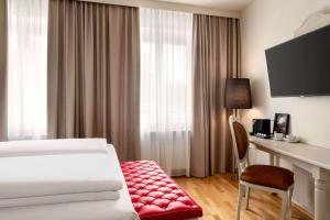 Telewizja i/lub zestaw kina domowego w obiekcie Amedia Plaza Wels, Trademark Collection by Wyndham