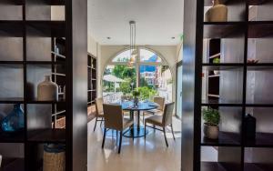a dining room with a table and chairs at Columbus Hotel Monte-Carlo, Curio Collection by Hilton in Monte Carlo