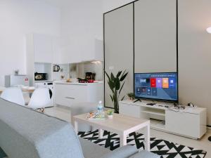 a living room with a couch and a tv at Delight Homestay Twin Galaxy Studio Room in Johor Bahru