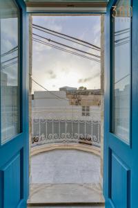 a view from a window of a balcony at Charming + Modern 1BR House in Historic Zebbug by 360 Estates in Żebbuġ