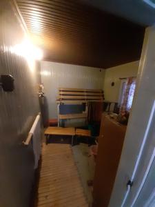 a room with a hallway with a room with a refrigerator at Garden Caravan in Rovaniemi