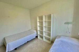 Postel nebo postele na pokoji v ubytování BoschApartamento de 2 dormitorios y con piscina + 19 fotografií