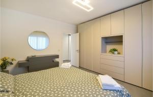 a small bedroom with a bed and a sink at Awesome Apartment In Pedavena With Wifi in Pedavena