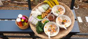 a basket of food on a picnic table at หัวน้ำฮิลล์huanamhill in Pua