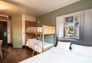 Postel nebo postele na pokoji v ubytování B&B HOTEL Limoges 1