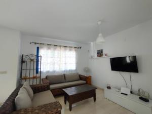 Telewizja i/lub zestaw kina domowego w obiekcie Villa Rubicón Costa