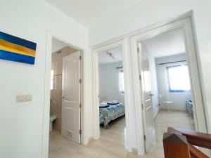 Łóżko lub łóżka w pokoju w obiekcie Villa Rubicón Costa