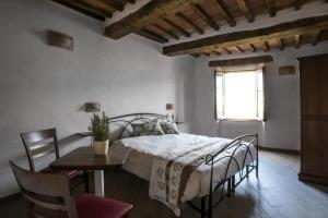 En eller flere senge i et værelse på Antico Borgo Seggiano