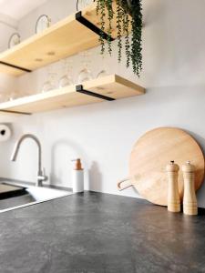 a kitchen with a counter top and a sink at Spot Caché - Waterfront - Water sports included! in Papineauville