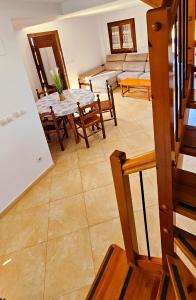 a living room with a table and a couch at CASA COTIELLA RAÑIN in Rañín