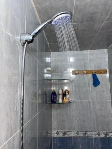 a shower with a shower head in a bathroom at Dar El Yacout in Rabat
