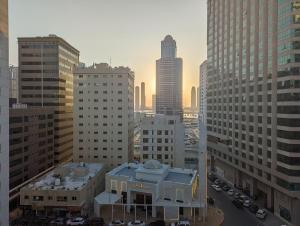 an aerial view of a city with tall buildings at Room for Rent in a Family Apartment- Waterfront View in Sharjah