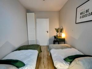 Säng eller sängar i ett rum på ApartamentySnu, Bulwary III Z parkingiem