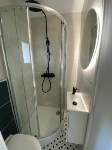 Ванная комната в L'Escale Appartements et Suites en bord de Mer
