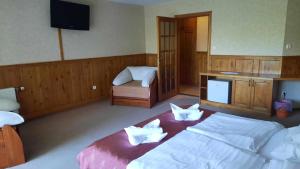 Cama o camas de una habitación en Atryum Hotel és Panzió