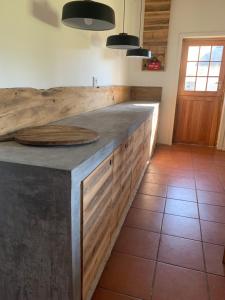 a kitchen with a wooden counter top in a room at Stormberg River Lodge in Elliot