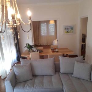 a living room with a couch and a table at PHILOS Apartment in Old Town Xanthi in Xanthi