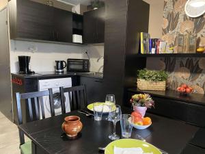 a kitchen with a table with food on it at Charmant T2 rénové avec clim, WiFi et parking à 15 min des Thermes de Balaruc-les-Bains - FR-1-553-229 in Balaruc-les-Bains