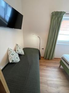 Letto o letti in una camera di Apart 7 Stuben