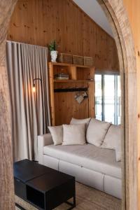 a living room with a white couch and a window at Le 2800 du Parc in Shawinigan +37 photos
