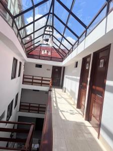 a hallway of a building with a glass ceiling at VIRREYES HOTEL in Potosí