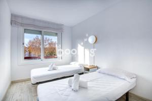 Postel nebo postele na pokoji v ubytování Vall de ribes Apartament per 4 persones amb piscina comunitària, a prop de Port d'Aro