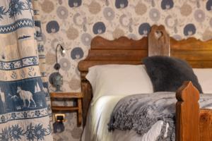 Postel nebo postele na pokoji v ubytování Chalet d'Aoste