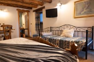 Postel nebo postele na pokoji v ubytování Chalet d'Aoste