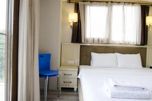 Postel nebo postele na pokoji v ubytování Funda Hotel