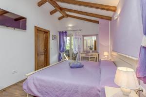 Ένα ή περισσότερα κρεβάτια σε δωμάτιο στο Villa Stancija Martina