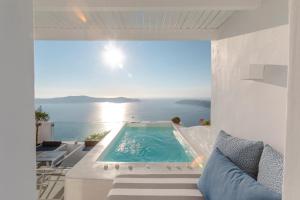 a swimming pool with a view of the ocean at Aether Suite by Caldera Houses in Imerovigli