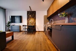 Kuchyň nebo kuchyňský kout v ubytování Laguna Beskidów Resort - Apartament A85