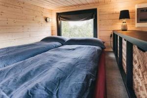 Postel nebo postele na pokoji v ubytování Idyllisches Tiny House III mit Sauna