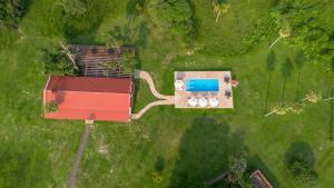 an aerial view of a house and a swimming pool at Estancia Iberá in Colonia Carlos Pellegrini