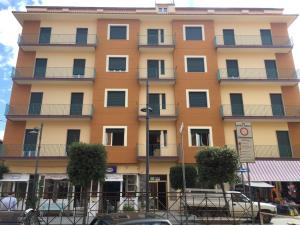 a tall building with balconies on the side of it at SanMarco Holiday Home in Ascea