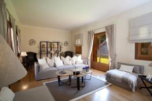 מיטה או מיטות בחדר ב-Villa Veneziano Suites & Villa