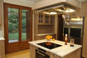 a kitchen with a sink and a stove top oven at Villa Veneziano in Nydri