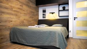 Un pat sau paturi într-o cameră la Apartmán u potoka
