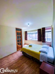 Chacraraju Hostel tesisinde bir odada yatak veya yataklar
