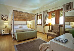 מיטה או מיטות בחדר ב-Villa Veneziano Suites & Villa
