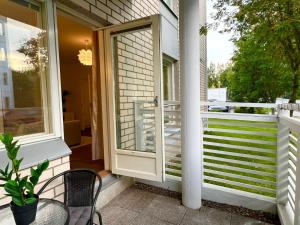 an open door on a house with a porch at Viihtyisä kaksio Annalassa, Free parking & Sauna in Tampere