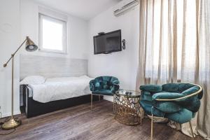 Ein Bett oder Betten in einem Zimmer der Unterkunft National Plus