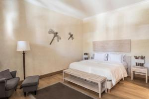מיטה או מיטות בחדר ב-Villa Veneziano Suites & Villa
